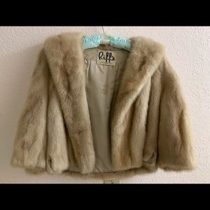 This is a mink winter coat. It’s a small.